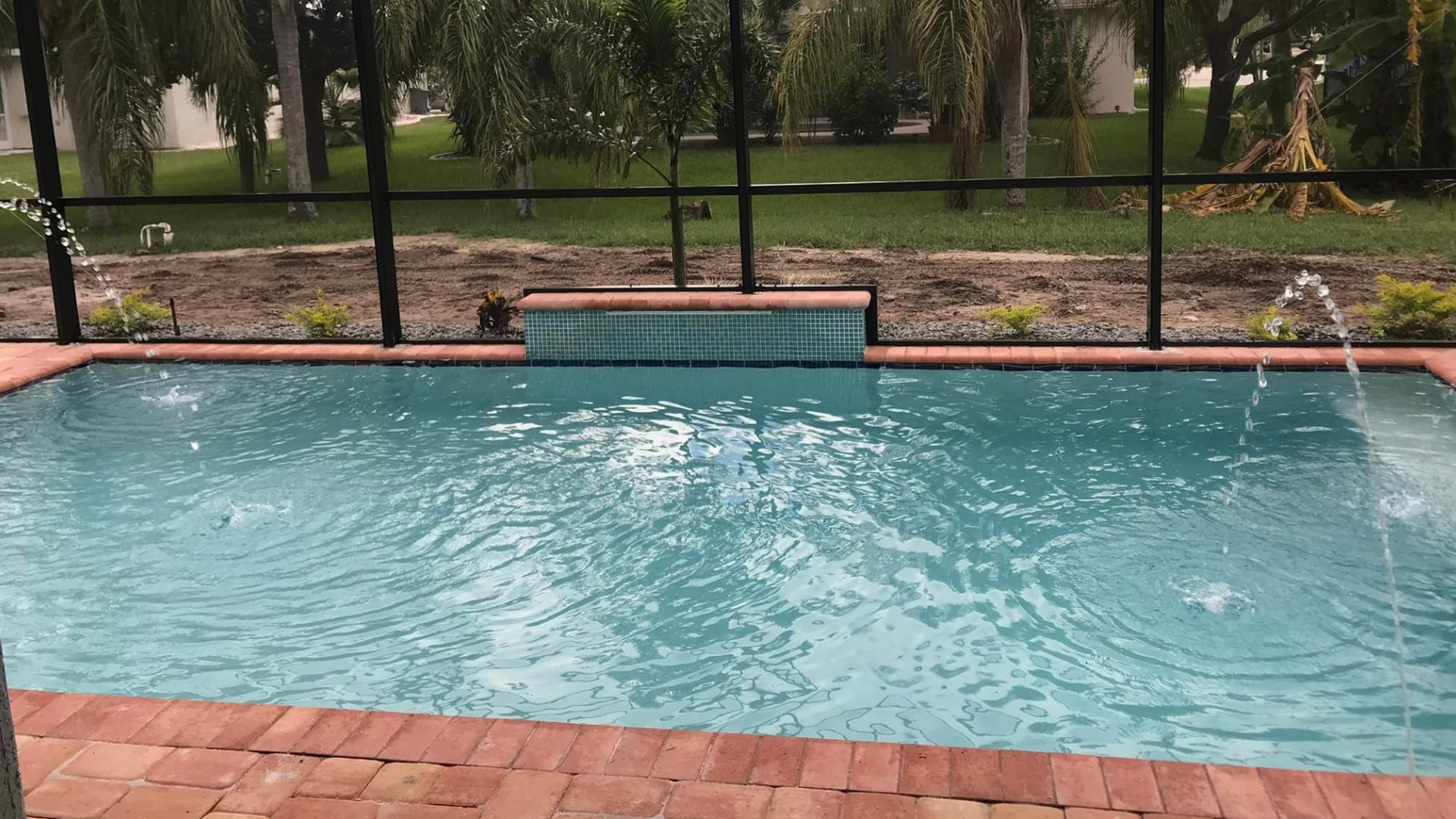 Water Features With Brick Decking Around Pool